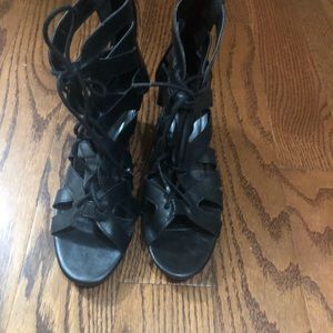 Wedge sandal ties in the front and zip up the back